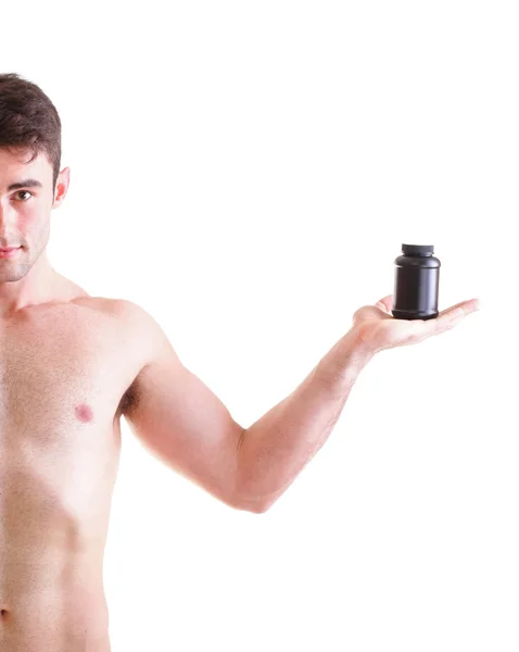 Holding a boxes with supplements on his biceps — Stock Photo, Image