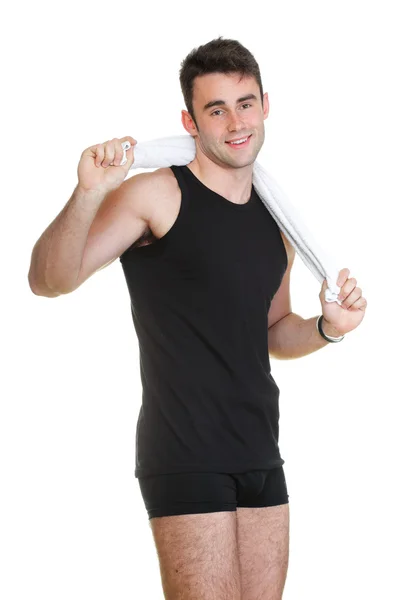 Gezonde jonge man met een handdoek geïsoleerd — Stockfoto