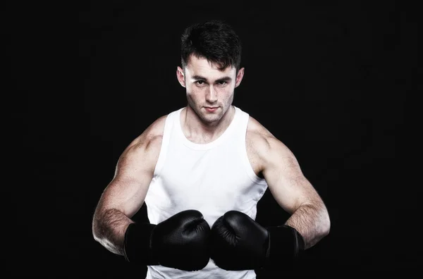 Portrait sportsman boxer in studio dark background — Stock Photo, Image