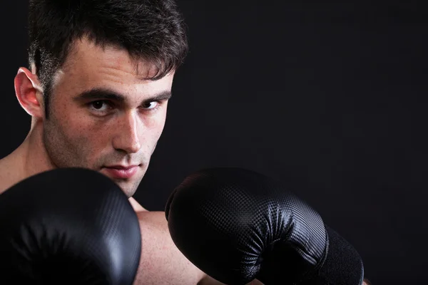 Portrait sportsman boxer in studio dark background Stock Photo