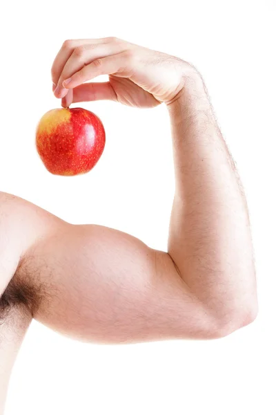 Athletic sexig manliga kroppen byggare holding rött äpple Royaltyfria Stockbilder