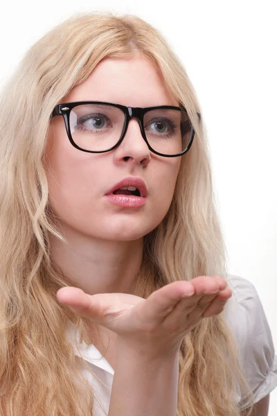 Beautiful young woman blowing a kiss — Stock Photo, Image