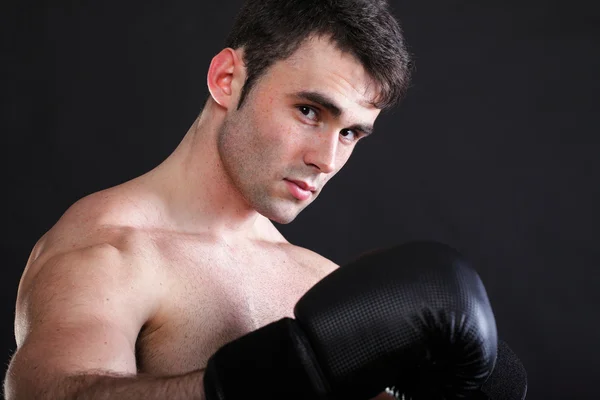 Portrait sportsman boxer in studio dark background — Stock Photo, Image