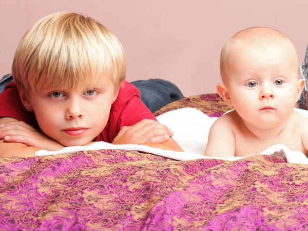 Little boy playing with a brother — Stock Photo, Image