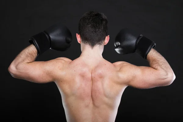 Portrait sportsman boxer in studio dark background — Stock Photo, Image