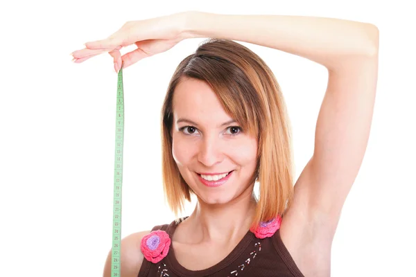 Beautiful young caucasian woman measuring her body with tape iso — Stock Photo, Image