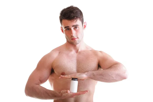 Sexy mannelijke lichaam bouwer houden een dozen met supplementen — Stockfoto