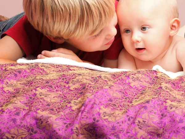 Little boy playing with a brother — Stock Photo, Image