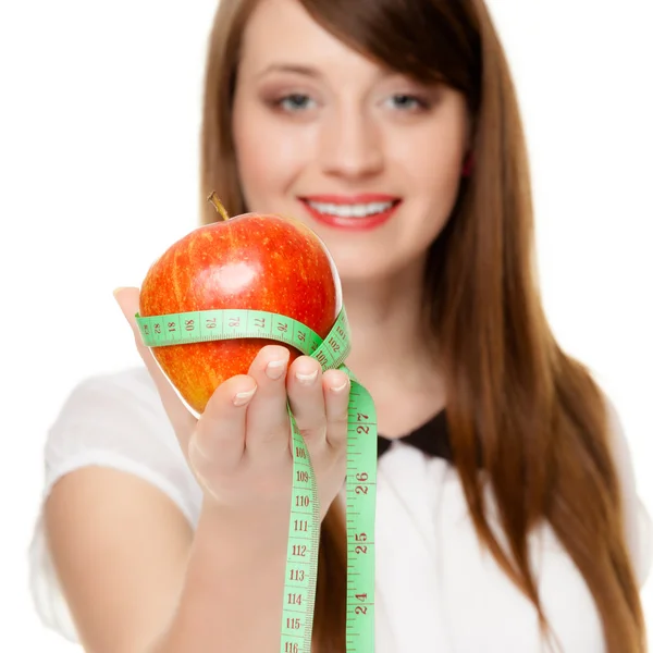 Diet. Girl holding apple with measure tape — Stock Photo, Image