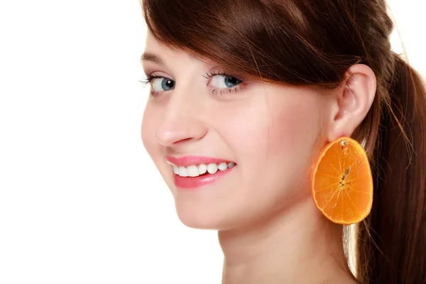 Diet. Girl with earrings of orange fruit isolated — Stock Photo, Image
