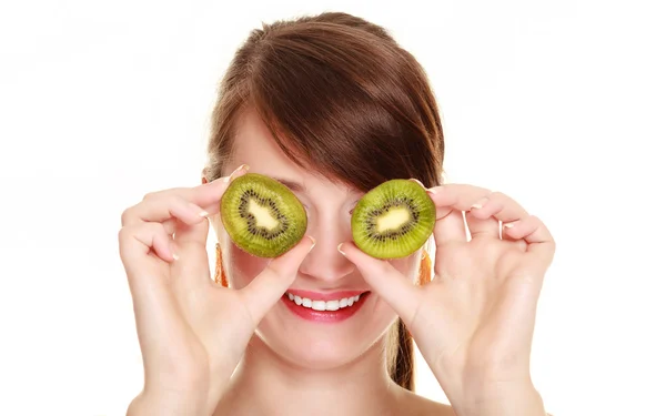 Girl covering eyes with kiwi tropical fruit — Stock Photo, Image