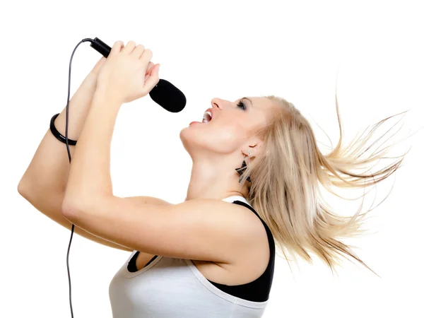 Girl singer singing to microphone isolated on white. — Stock Photo, Image