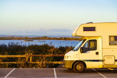 Camper car rv camping on coastal rest area. San Pedro del Pinatar park, Murcia Spain. Tourist attraction. Activity on holidays