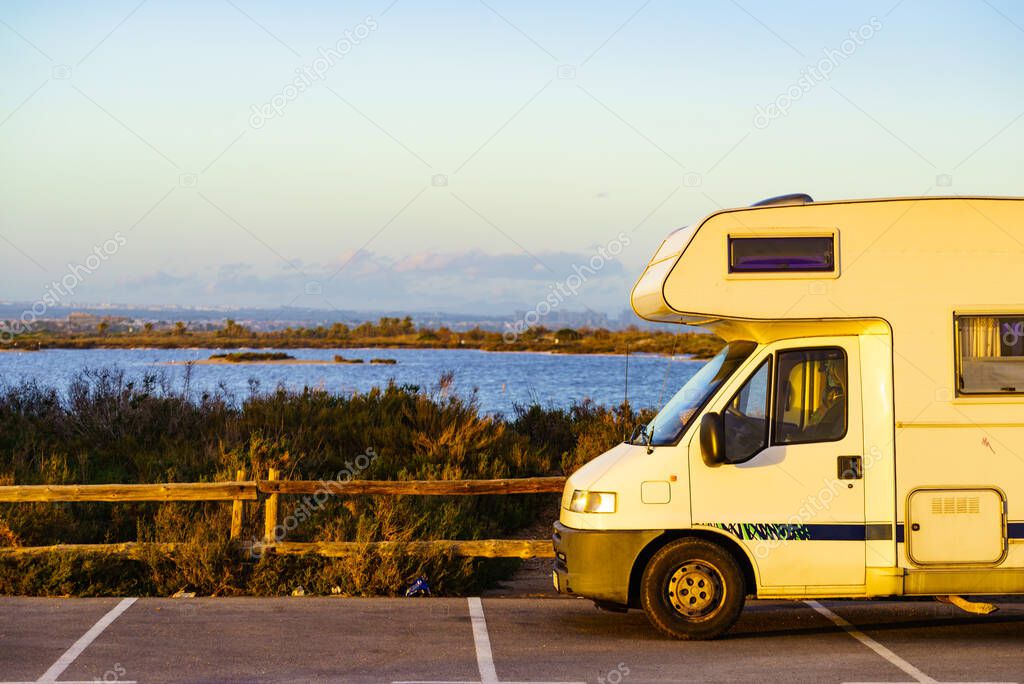 Camper car rv camping on coastal rest area. San Pedro del Pinatar park, Murcia Spain. Tourist attraction. Activity on holidays