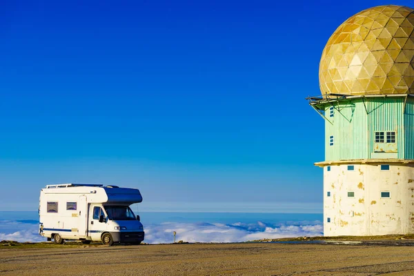 Caravan camping in mountains above clouds. Torre mountain peak of Serra da Estrela in Portugal. Place to visit. Adventure and holiday by mobile home.