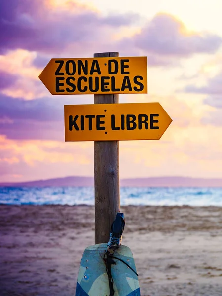 Sign in spanish at beach navigate lesson and kitesurfing. Sports activity.