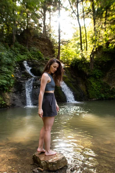 Young Woman Stands Waterfall — Zdjęcie stockowe