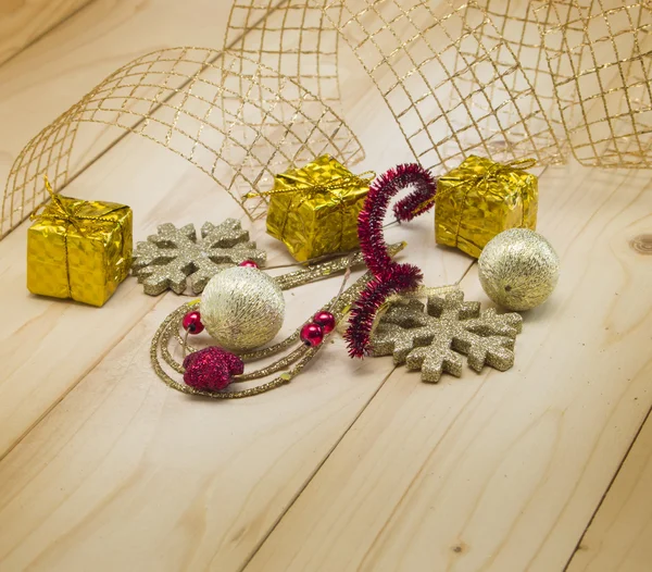 Christmas background with toys and golden ribbon — Stock Photo, Image