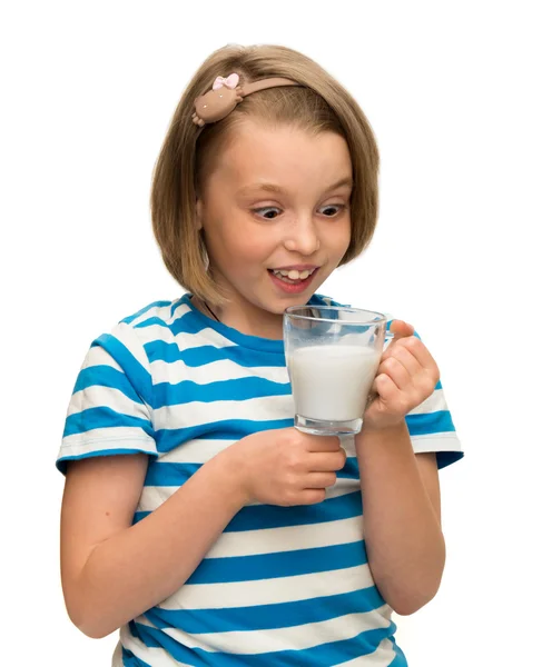 Little girl is holding a glass with milk — Stock Photo, Image