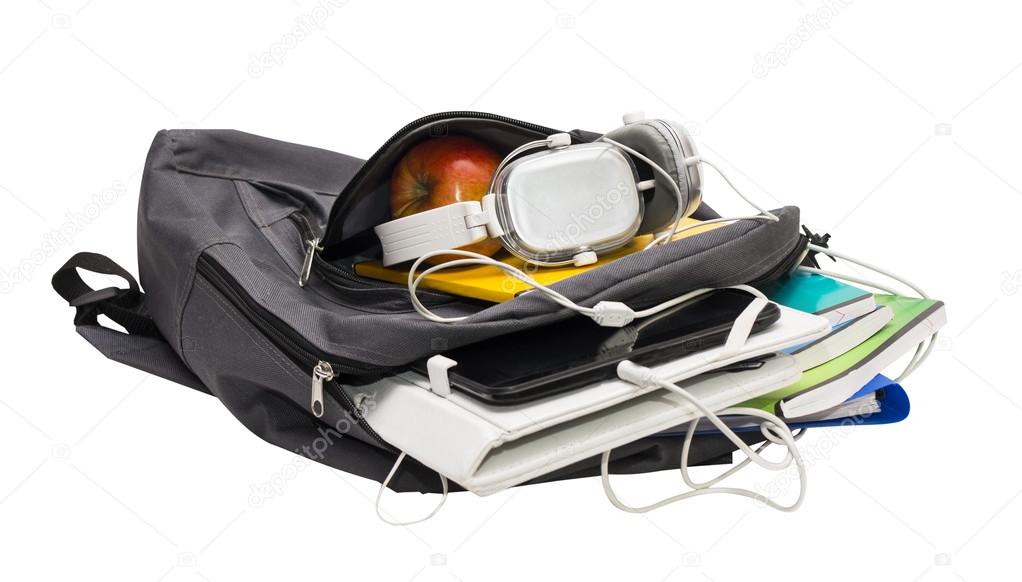 School backpack with school supplies and a tablet with headphone