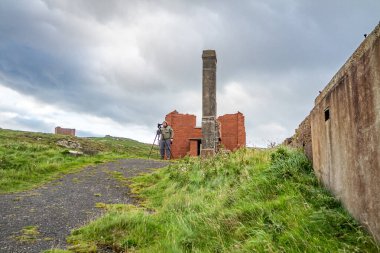 İrlanda 'nın Donegal ilçesinin kuzey kıyısındaki Lenan Head kalesinin kalıntıları..