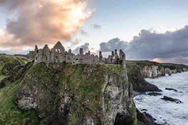 Dramatic sky above Dunluce Castle, County Antrim, Northern Ireland. clipart