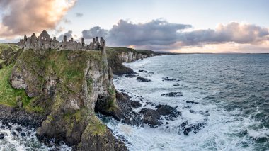 Dramatic sky above Dunluce Castle, County Antrim, Northern Ireland. clipart