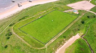 Aerial view of the Killybegs GAA pitch at Fintra beach by Killybegs, County Donegal, Ireland.