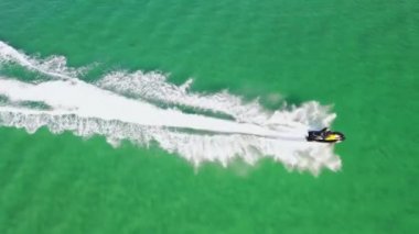 Aerial of jet ski driving on the Atlantic Ocean in Dwoning, County Donegal - Ireland.
