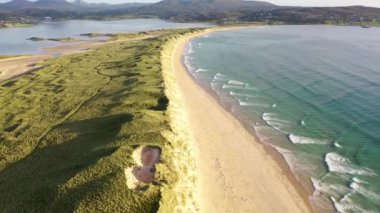 Machaire Rabhartaigh, Translation: Magheraroarty - Plane of the spring tideplane of roarty, Gaeltacht village and townland in north-west of County Donegal, Ireland