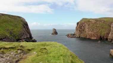 The cliffs and sea stacks at Port Challa on Tory Island, County Donegal, Ireland.