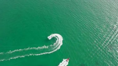 Aerial of jet ski driving on the Atlantic Ocean in Downings, County Donegal - Ireland.
