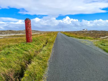 World War Torpedo standing next to road on Tory Island, County Donegal, Ireland.