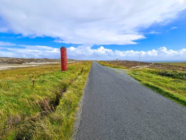 World War Torpedo standing next to road on Tory Island, County Donegal, Ireland.