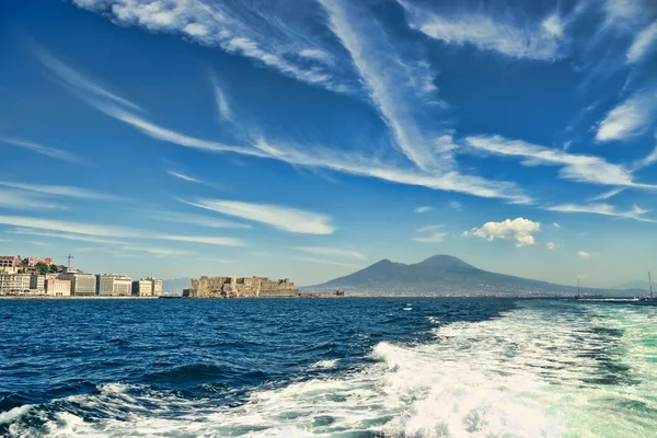 Mount Vesuvius and castle from a boat — Stock Photo, Image