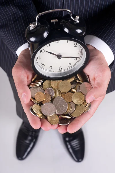 Coins and alarm — Stock Photo, Image