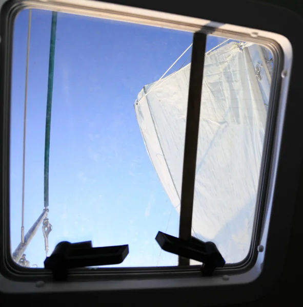 Boat porthole sailboat view blue ocean sea sky sail — Stock Photo, Image