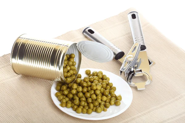 Tin opener opening a can of food canned, tinned peas Stock Image