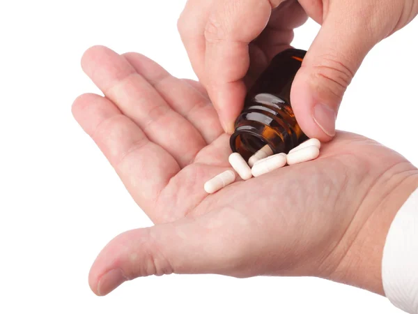 Man with pill - white pills in man hand isolated — Stock Photo, Image