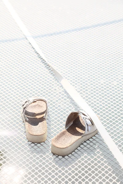 Slippers on white fence background yacht — Stock Photo, Image