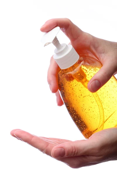 Applicazione di sapone liquido. Bottiglia a due mani con sapone liquido isolato su sfondo bianco. — Foto Stock