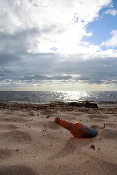 Bottle on beach sea and sky — Stock Photo, Image