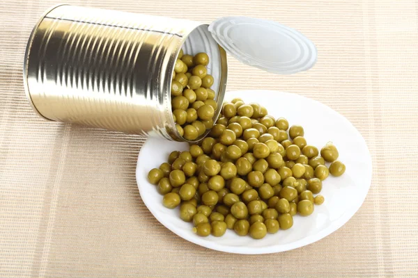 Tin opening a can of food canned, tinned peas Stock Image