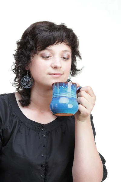 Woman holding a blue cup, isolated — Stock Photo, Image