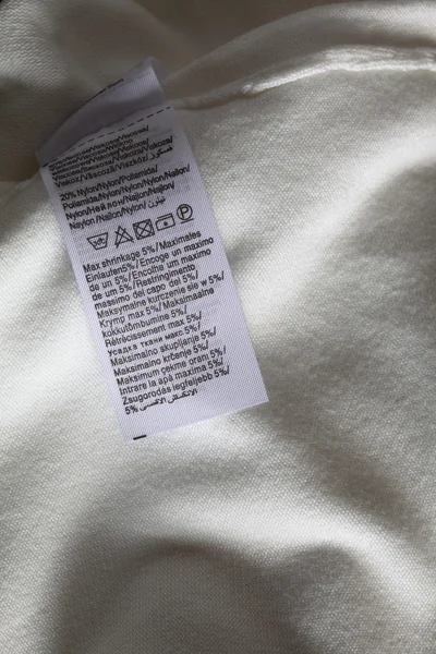 Makro dari label pakaian putih — Stok Foto