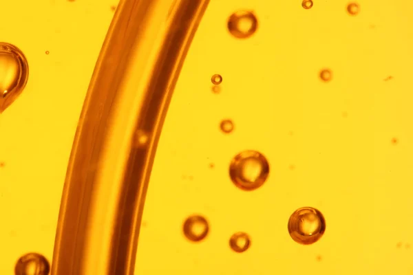 Soap bubbles orange liquid — Stock Photo, Image