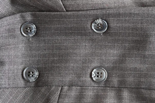 Button on a gray suit — Stock Photo, Image