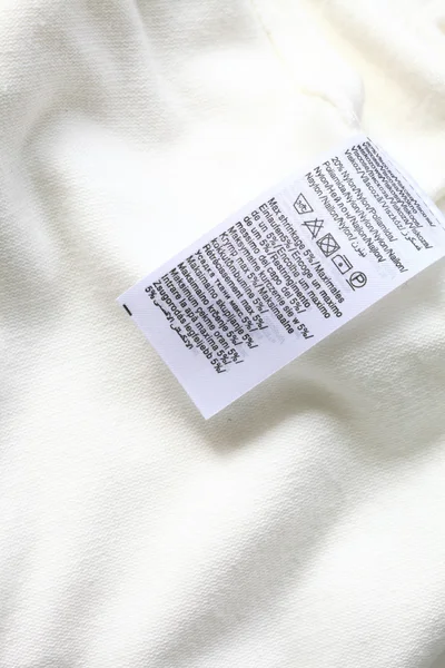 Macro de etiqueta de ropa blanca — Foto de Stock