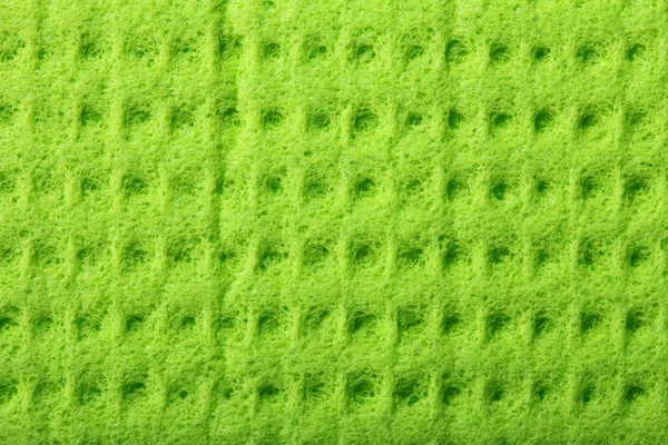 Green sponge foam as background texture — Stock Photo, Image