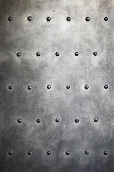 Black metal plate or armour texture with rivets Royalty Free Stock Images